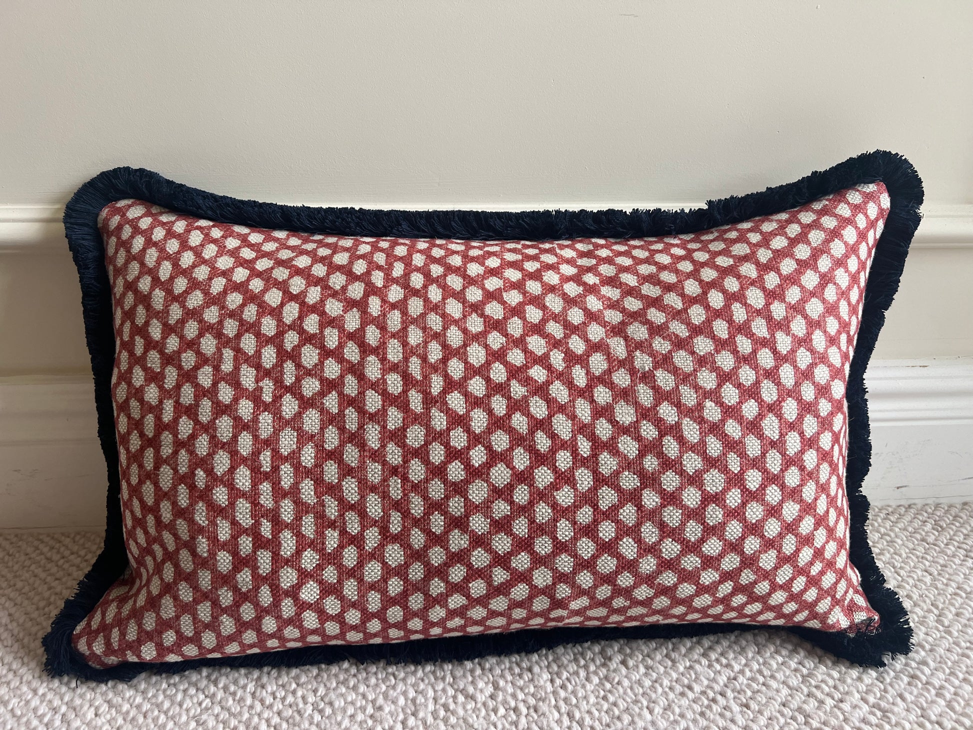 Luxury patterned cushions in Fermoie red Wicker fabric