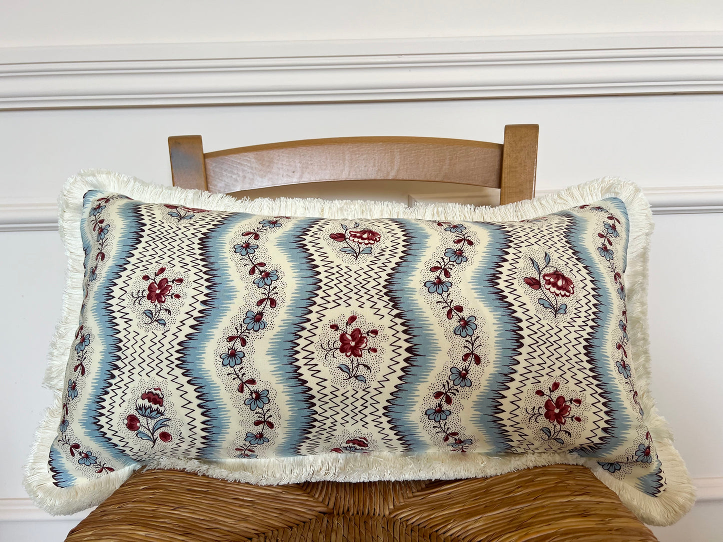 Cushions in Pierre Frey Le Manach Greuze fabric. Bleu Rouge colourway