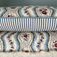 Cushions in Pierre Frey Le Manach Greuze fabric. Bleu Rouge colourway